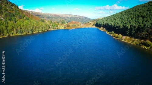 Llyn Geirionydd lies in a valley in North Wales where the northern edge of the Gwydyr Forest meets the lower slopes of the Carneddau mountains. The lake is almost a mile long and covers an area of 45  photo