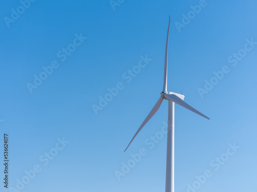 wind turbine against sky © andybirkey