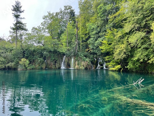 lake and forest with waterfall