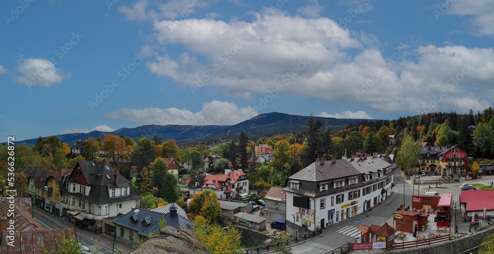 Fototapeta premium view overlooking the town with picturesque nature in autumn. szklarska poreba, karkonosze, poland