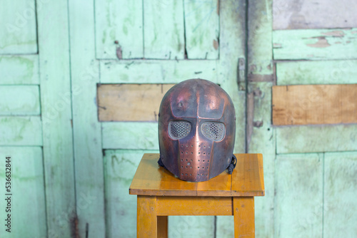 old wooden mask at woodenn chair in indonesia photo
