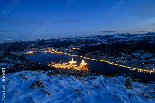 Fjord on the west coast of Norway with Oil rigs at night photo