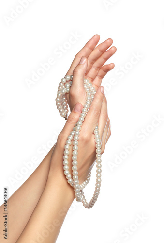 Woman holding elegant pearl necklace on white background, closeup