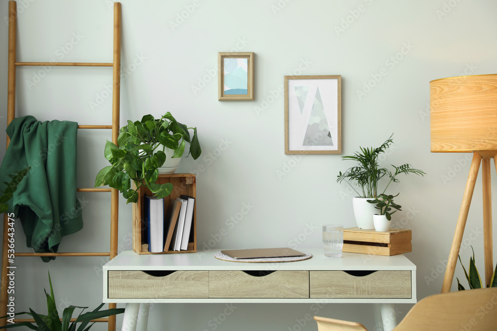 Fototapeta premium Home office interior with different beautiful houseplants