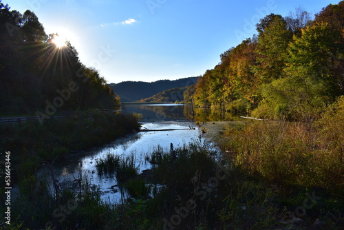 sunset on small mountain lake in wv