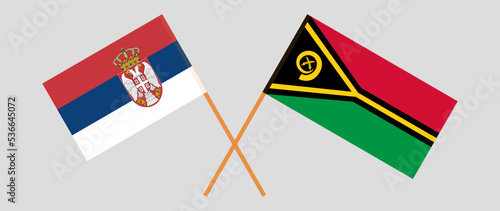 Crossed flags of Serbia and Vanuatu. Official colors. Correct proportion