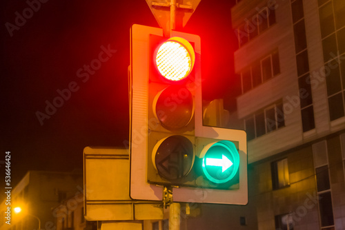 Traffic light in the city center in the evening.