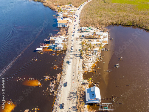 Fotografia, Obraz Aerial drone inspection photo Matlacha Florida Hurricane Ian aftermath damage an