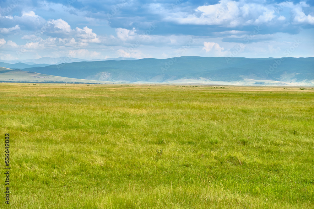 Steppe in the Barguzin Valley of the Republic of Buryatia on a clear sunny day.