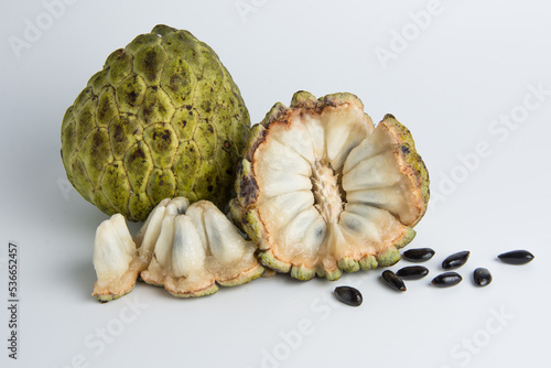 sugar apple ( srikaya ) with black spots, isolated on a white background, sugar apple fruit tastes sweet, grows in the tropics. can be eaten directly when it is ripe or can be processed first. photo