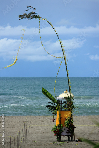 Canang sari is a place where offerings for Hindus are placed on a quiet coast photo