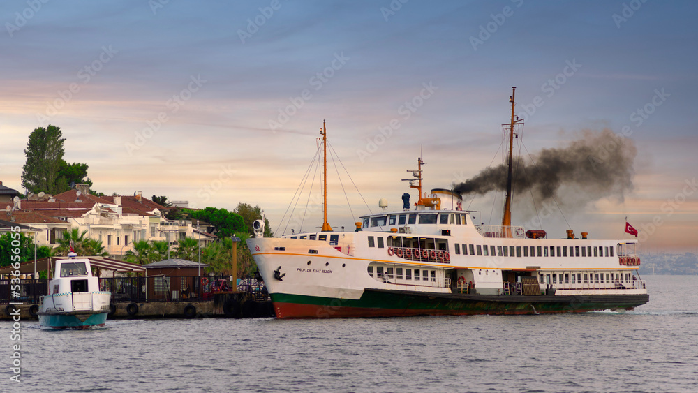 Modern ferry boat departing Kinaliada Island Ferry Terminal in Marmara sea at dawn, near Istanbul, Turkey Modern ferry boat departing Kinaliada Island Ferry Terminal in Marmara sea at dawn, near Istanbul, Turkey