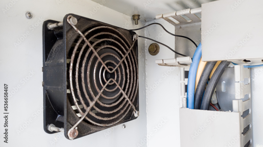 Heat dissipation fan on electrical panel to cool working electrical