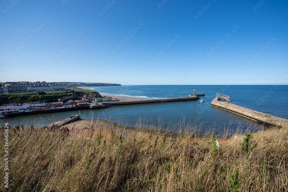 Whitby harbour entrance in North Yorkshire England on a clear sunny summers day