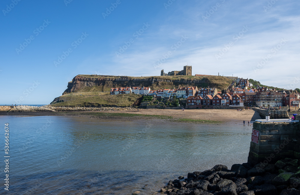 Whitby in Yorkshire England with the Abbey on the top of the cliffs