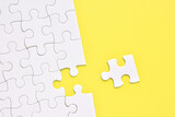 Jigsaw puzzle on a yellow background  
