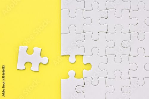 Jigsaw puzzle on a yellow background 