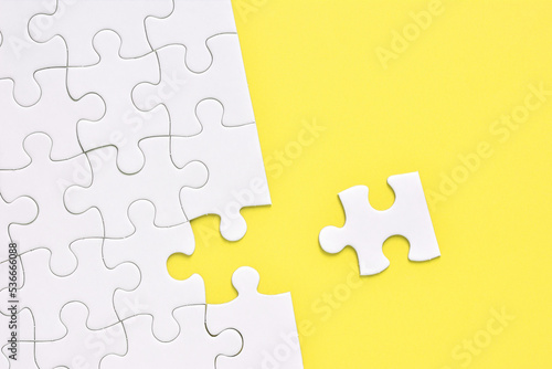 Jigsaw puzzle on a yellow background 