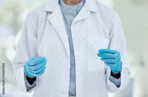 Healthcare, hand and doctor with covid test in a hospital, hands holding pcr test and swab. Research, health and innovation closeup of nurse doing analysis of corona testing results medical sample