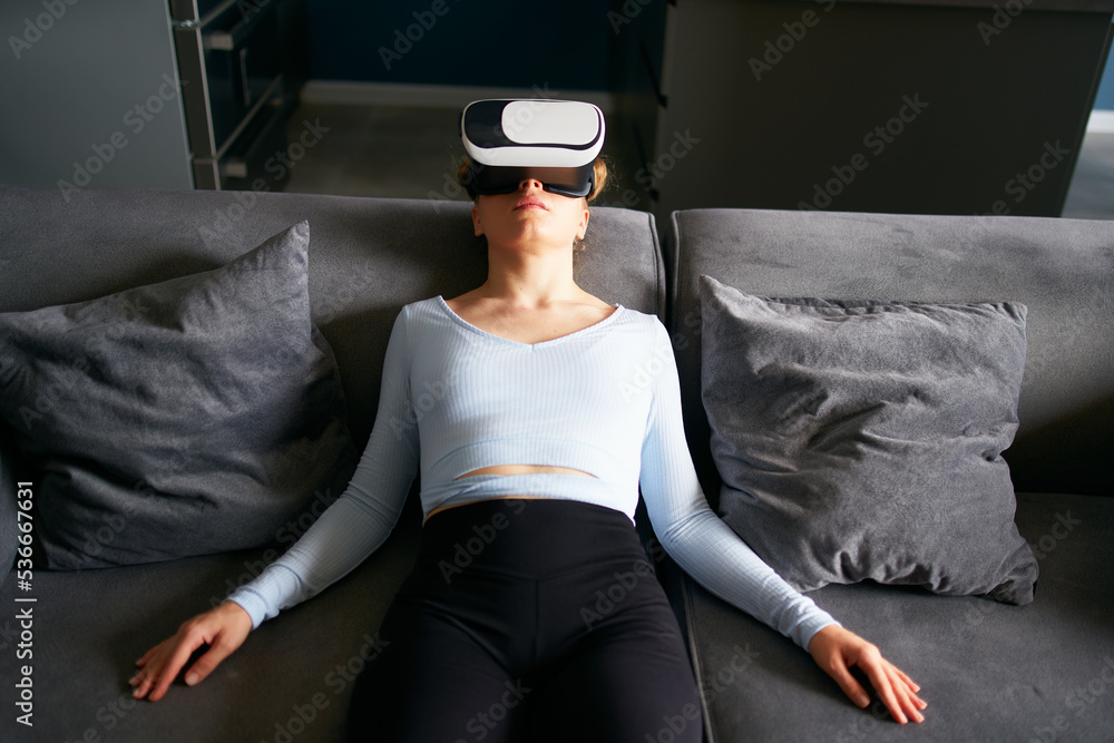 Robot like futuristic doll woman in virtual reality goggles interface