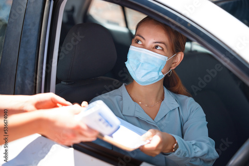 Car driver, face mask and document covid woman exam medical report for security, safety and corona virus protection. Paper form, girl worker and motor vehicle pass Covid 19 healthcare test questions
