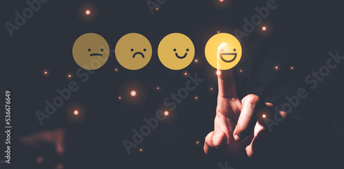 Man choosing happy smiley face icon. feedback rating and positive customer review experience, satisfaction survey. mental health assessment. world mental health day concept.