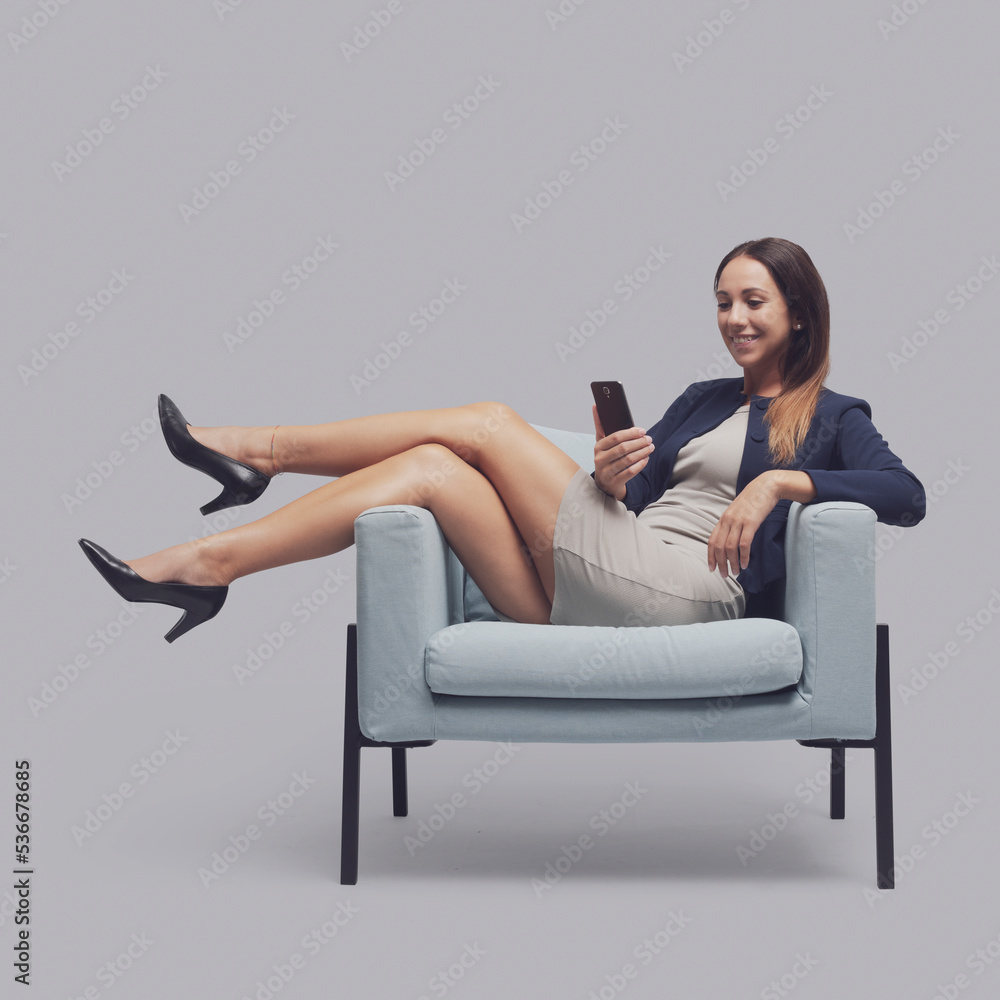 Businesswoman videocalling with her smartphone Businesswoman videocalling with her smartphone