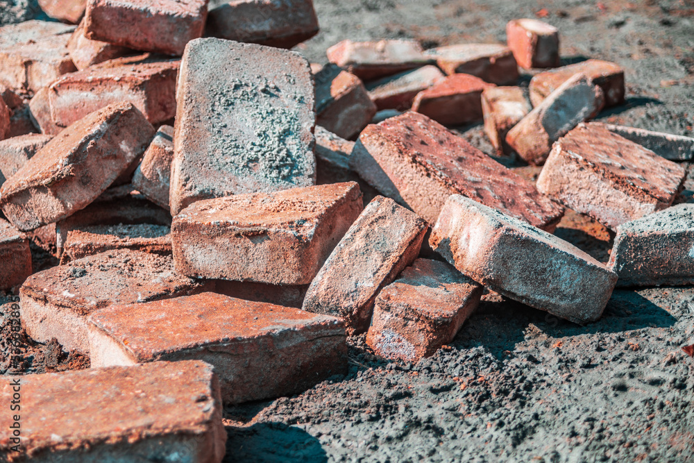 Closeup pile of paver bricks laying on the ground Closeup pile of paver bricks laying on the ground