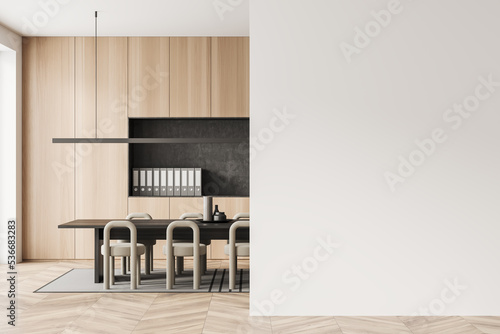 Minimalist office room interior with chairs, table and shelf with documents. Mockup wall
