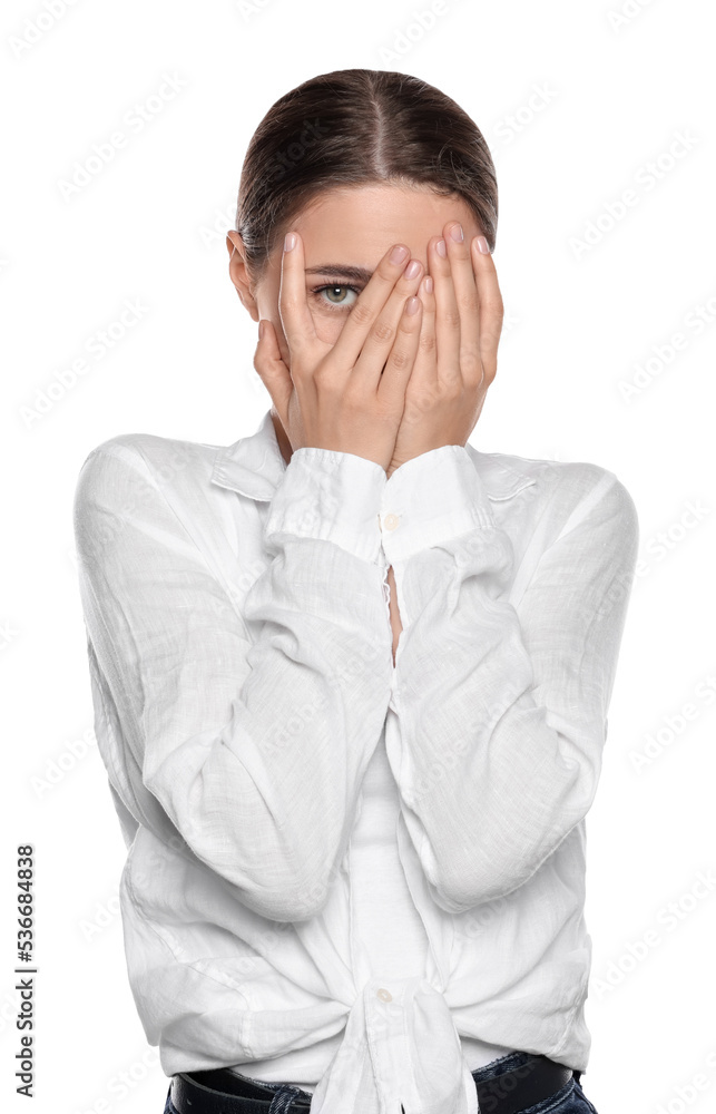 Embarrassed young woman covering face with hands on white background Embarrassed young woman covering face with hands on white background