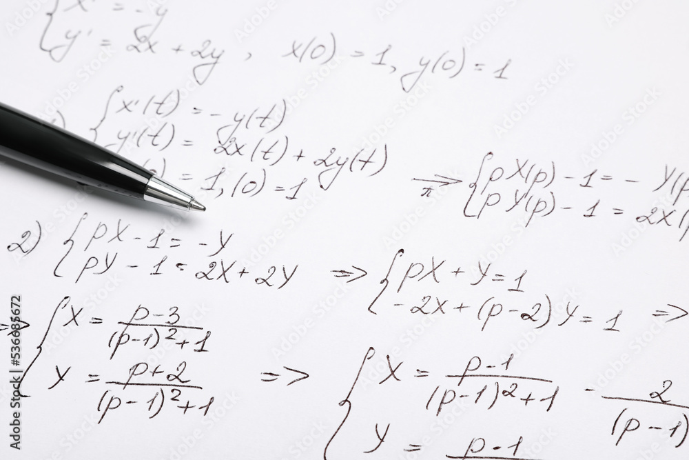 Sheet of paper with mathematical formulas and pen, closeup Sheet of paper with mathematical formulas and pen, closeup