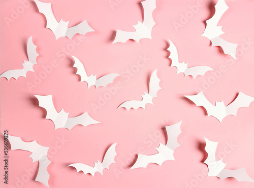 Halloween paper decorations bats on pastel pink colors.