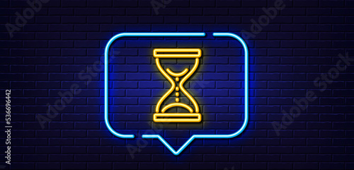 Neon light speech bubble. Time hourglass line icon. Sand watch sign. Neon light background. Time hourglass glow line. Brick wall banner. Vector