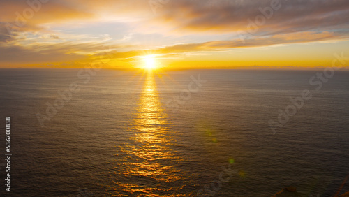 Breathtaking sunset in the calm ocean at the Cabo da Roca  Portugal.