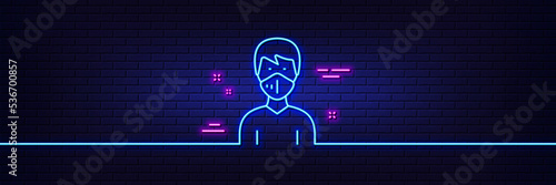 Neon light glow effect. Man with medical mask line icon. Safety breathing respiratory mask sign. Coronavirus face protection symbol. 3d line neon glow icon. Brick wall banner. Vector