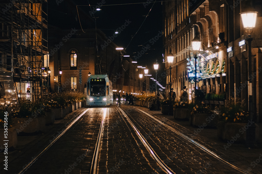 Tram coming during the night in the old town of Munich