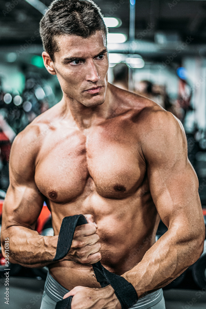 Fototapeta premium Confident athlete man in gym