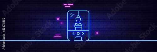 Neon light glow effect. Crane claw machine line icon. Amusement park sign. Carousels symbol. 3d line neon glow icon. Brick wall banner. Crane claw machine outline. Vector