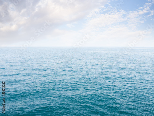 Blue Sea and Bue Sky Background,Ocean at Coast Free Space,Texture Surface Water,Crear Water Backdrop,Outdoor Calm Nature,for Tourist Travel Summer Holidays Tropical or Environment Concept.