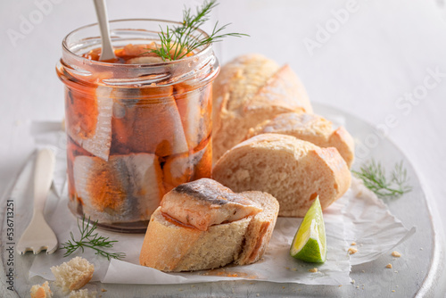 Healthy and tasty pickled herring served with bread and dill.