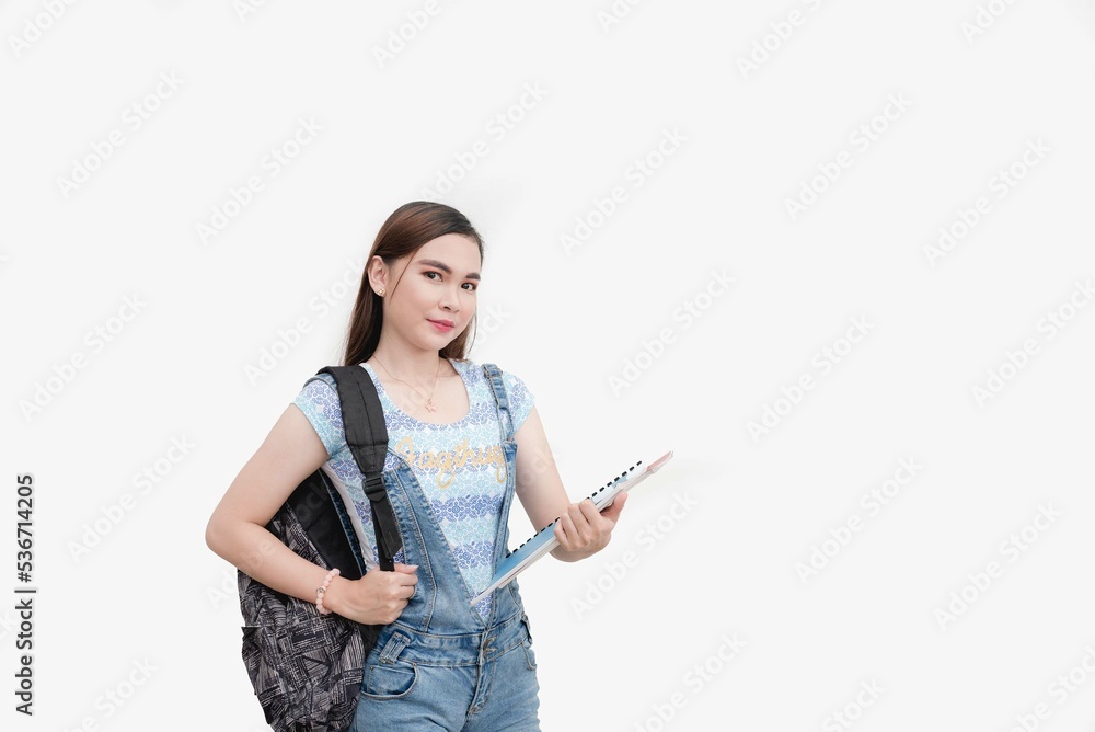 A beautiful Asian school girl carrying a backpack and holding folders is ready for senior high school life. Studio shot isolated white background. A beautiful Asian school girl carrying a backpack and holding folders is ready for senior high school life. Studio shot isolated white background.