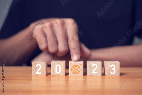 Woods block step on table with icon Year Action Plan 2023 and goals, success concepts and business goals.
