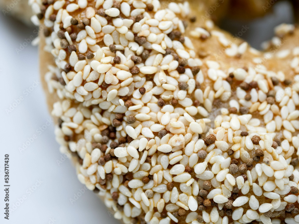 Homemade Bagels with multi grains such as sesame, perilla seeds and pumpkin seeds with white background Homemade Bagels with multi grains such as sesame, perilla seeds and pumpkin seeds with white background