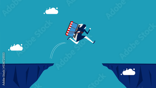 Risks and obstacles of online business. businesswoman with an online shopping laptop jumps over the gap