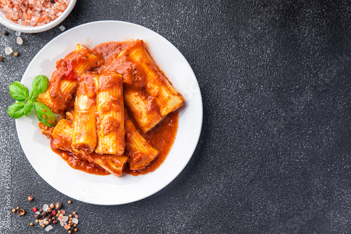 cannelloni pasta dish stuffed with meat tomato sauce healthy meal food snack diet on the table copy space food background rustic top view photo
