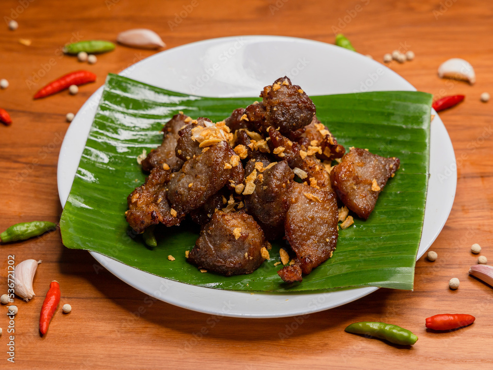 Fried pork with garlic and pepper on plate, Thai food