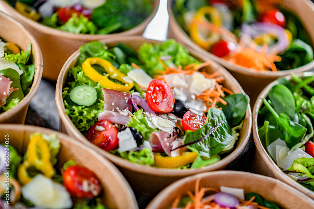 Paper boxes with pre-packaged vegetable salads ready for sale Paper boxes with pre-packaged vegetable salads ready for sale