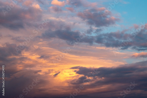 Fototapeta Naklejka Na Ścianę i Meble -  Texture of the sky with beautiful clouds, light from the sun at sunset