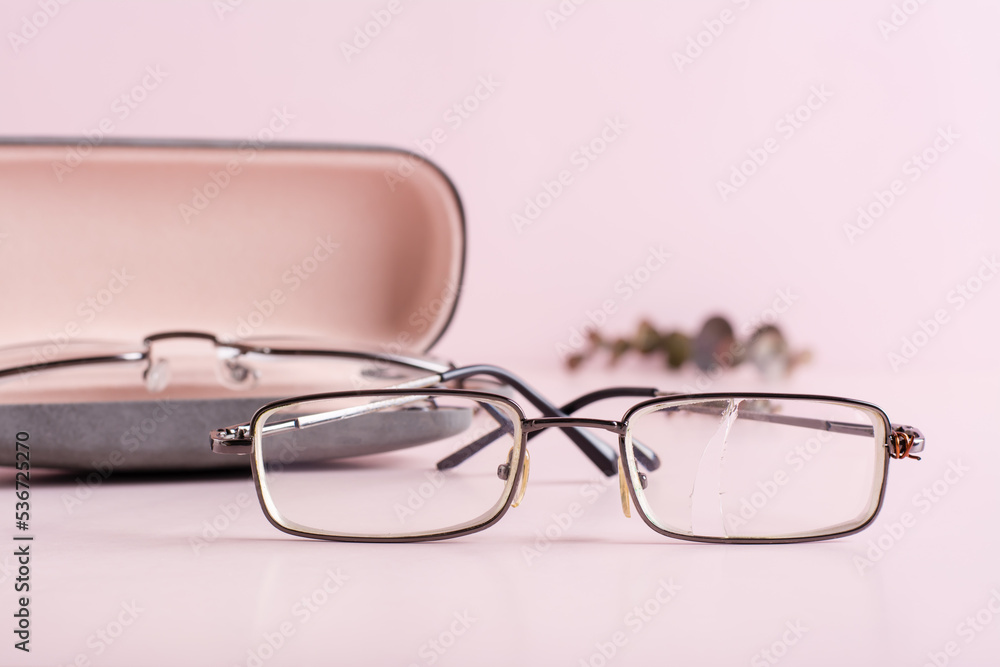 The concept of correct storage - broken glasses on the background of a hard case with glasses The concept of correct storage - broken glasses on the background of a hard case with glasses
