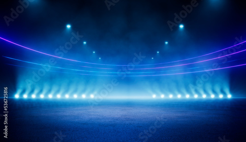 Abstract blue neon stadium background illuminated with lamps on ground. Science, product and sports technology background